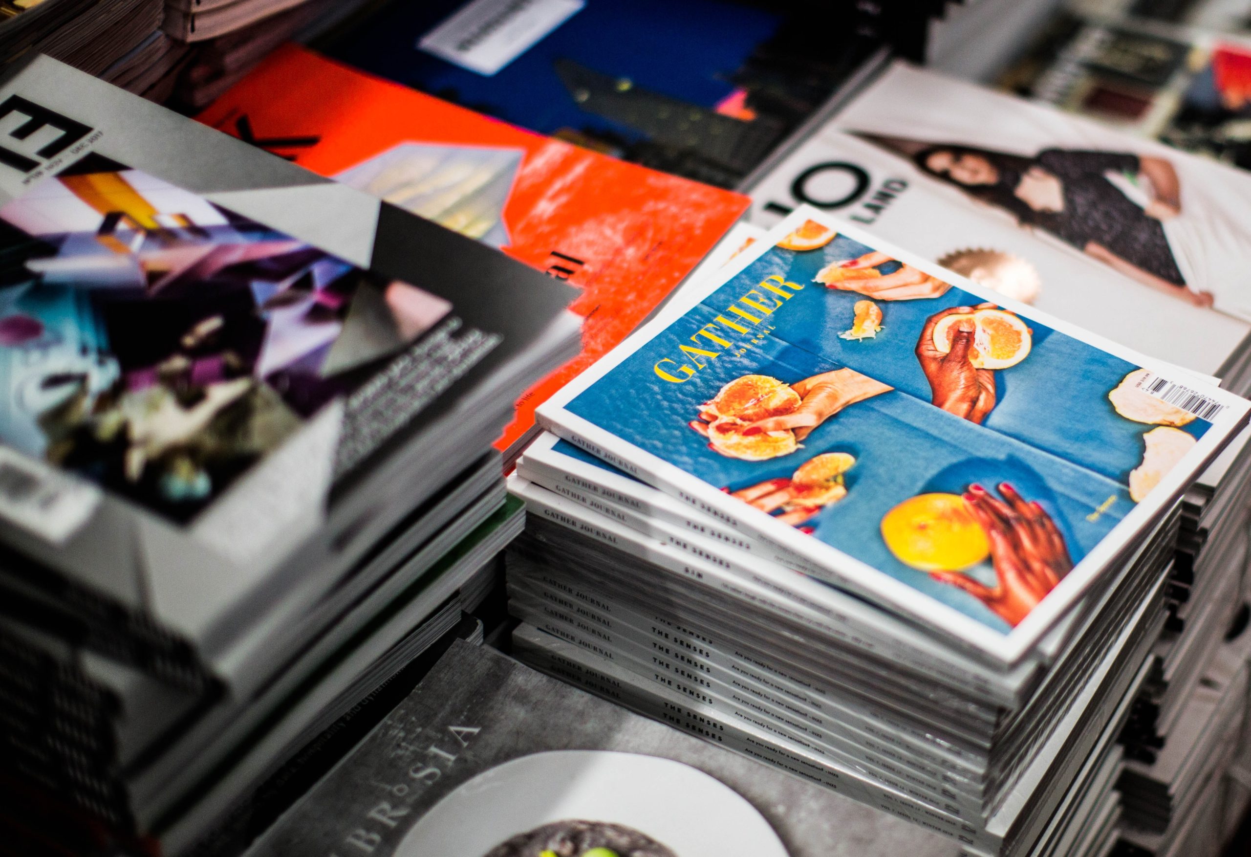 Magazines stacked up in a store